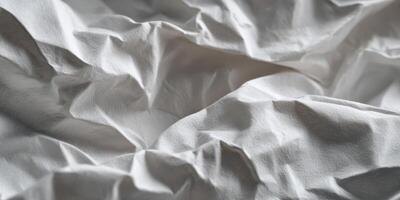 Close up of soft crumpled white fabric texture photo