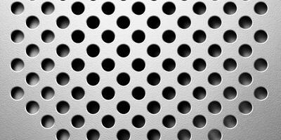 close up of perforated metal sheet with round holes pattern photo