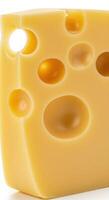 A perfectly lit block of Swiss cheese with characteristic holes on a white background. photo