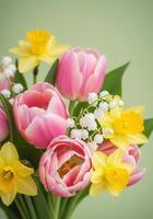 Beautiful arrangement of tulips, daffodils, and lily of the valley flowers. photo