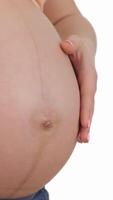 Pregnant woman lovingly forms a heart shape on her belly with gentle hands video