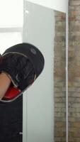 Dynamic MMA fighters delivering powerful punches in an electrifying training session video
