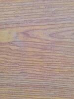 Natural wooden texture with smooth grain patterns in soft brown and yellowish tones, ideal for backgrounds and material design. photo