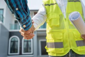 Construction team hands shake greeting start up plan new project contract in office center at construction site, industry ,architecture, partner, teamwork, agreement, property, contacts. photo