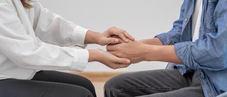 hold hand for support each while discussing family issues. doctor encourages and empathy woman suffers depression. psychological, save divorce, Hand in hand together, trust, care photo
