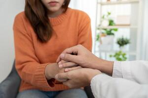 support each while discussing family issues. doctor encourages and empathy woman suffers depression. psychological, save divorce, Hand in hand together, trust, care photo