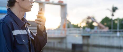 maintenance orinspector, Maintenance engineers are using walky talky to inform the results of inspection of buildings and structures. Irrigation engineers are exploring sluice systems photo