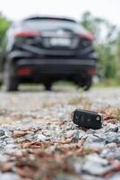 Lost car key on the ground. Car keys dropped on the floor or fall lying on the street home front. Walking Away From Lost Car Key, can not transport, express, rush time, wast time, emergency photo
