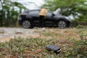 Lost car keys on the ground, Car keys dropped on the floor or fall lying on the street home front. Walking Away From Lost Car Key, can not transport, express, wast time, emergency photo