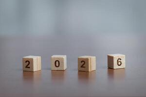 Wooden blocks display the year 2026, symbolizing new beginnings and future aspirations. photo