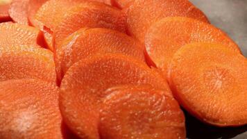sliced carrots on a baking sheet video