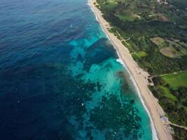aerial view of the beach and the ocean in the background photo