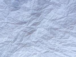White recycled craft paper texture as background. Grey paper texture, Old vintage page or grunge vignette of old newspaper. photo