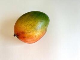 Ripe mango isolated on a white background photo