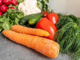 Healthy Organic Vegetable Assortment on Rustic Kitchen Background photo