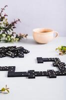 A calm domino board game for leisure on the table vertical view photo