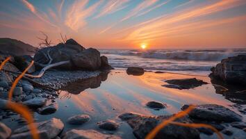 Calm Seascape at Sunset with Rocky Shore and Colorful Sky Reflection photo