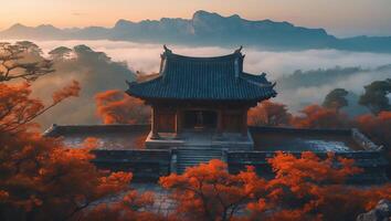 Majestic Temple Overlooking Autumnal Landscape with Distant Mountains and Fog photo