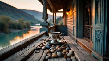 Drinking Tea on a Porch Overlooking a River at Sunset photo