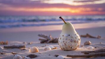 Pear Decorated with Seashells on Beach at Sunset with Calm Waves photo