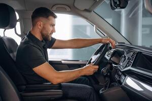 Man is sitting in ,,the car, driver. photo