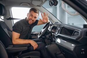 Man is sitting in the car, driver.,, photo