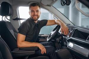 Man is sitting in ,the car, driver photo