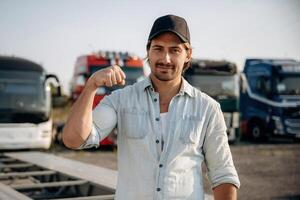 Fist, strength and power conception. Truck driver is near the transport outdoors photo