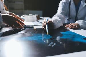 Two doctors are working on a computer with a blue background photo