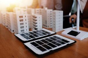 Solar power generation concept with business people in the background photo