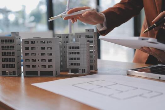 A man is working on a building model photo
