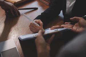 A business person writing on a notepad photo