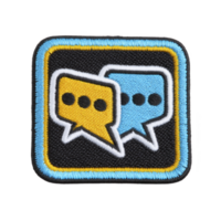 Colorful embroidered patch featuring two speech bubbles, one yellow and one blue, on transparency background with blue and yellow border. design symbolizes communication and conversation png