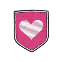 Pink embroidered patch features white heart design in center, outlined with black border. patch has shield shape, giving it bold and stylish appearance png