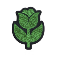 This shows green embroidered patch shape of stylized flower with leaves, set against transparency background. design is simple and decorative.Green embroidered flower patch transparency background png