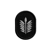 This features black oval patch with white embroidered leaf design, symbolizing nature and simplicity. monochrome color scheme adds classic touch to design png