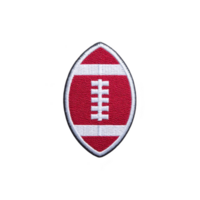 Red and white embroidered patch in shape of American football is displayed on transparency background. patch features classic football design with white laces png