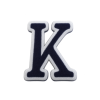 Bold, black letter K with white outline, resembling varsity or letterman jacket patch, is displayed against transparent background. design is simple and classic png