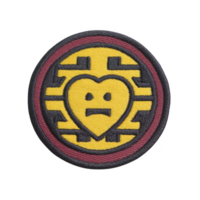This shows circular embroidered patch featuring stylized heart with face, set against geometric background. patch has yellow and black design with maroon border png