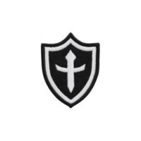 Black and white embroidered shield patch features cross design in center, symbolizing protection and faith. patch has classic, bold look suitable for various applications png