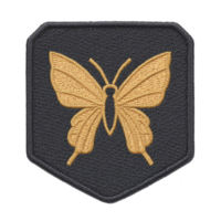 Golden butterfly embroidered patch on dark fabric background, showcasing intricate stitching and symmetrical design. patch has shield like shape, adding touch of elegance png