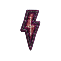 Beaded lightning bolt patch with pearls and red accents on transparency background, showcasing intricate craftsmanship and bold design png
