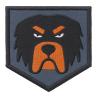 This features embroidered patch with stylized dog face design. patch has shield shape with transparency background, showcasing dog face with orange and black details, giving intense expression png