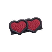 Two embroidered red heart patches with black borders are placed side by side, creating charming and playful design. These patches can be used for clothing decoration or crafting projects png