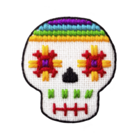 Colorful embroidered skull design inspired by Day of Dead, featuring vibrant patterns and textures. skull is adorned with multicolored threads, creating festive and artistic look png