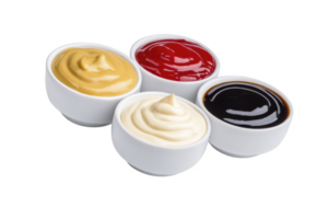 A four small white bowls filled with different sauces mustard, ketchup, mayonnaise, and barbecue sauce, arranged in group. sauces are creamy and vibrant, creating appetizing display png