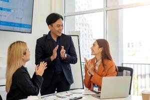 Team Collaboration and Problem Solving. Business professionals discussing project challenges in a modern office. photo