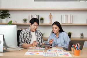 UX and UI Design Collaboration. Young professionals discussing color palettes and layouts in a modern workspace. photo