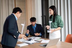 ESG Initiative Discussion. Professionals strategizing on sustainable practices in a modern workspace. photo