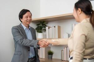 Professional Networking. Business partners shaking hands in a stylish office environment. photo